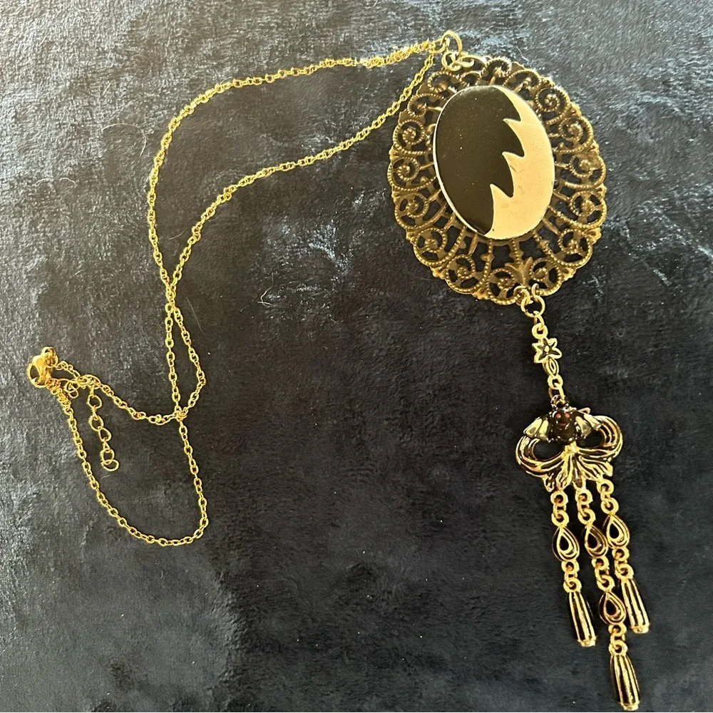 Handcrafted Cruella de Vil cameo bat accent pendant on chain necklace